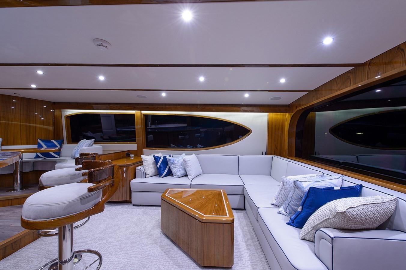 a room with a couch and a table aboard NOTORIOUS Yacht for Sale