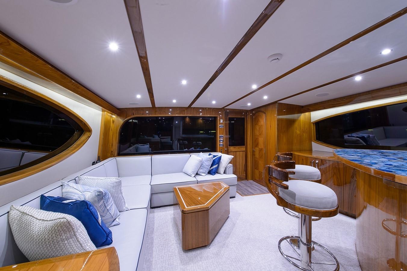 a room with a bed and a table aboard NOTORIOUS Yacht for Sale
