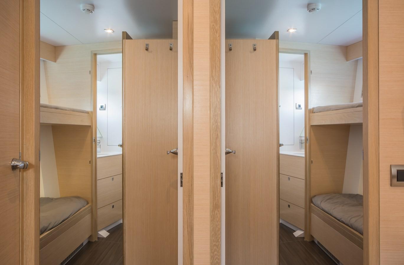 a room with wooden cabinets aboard YXT20 - SUPPORT VESSEL/YACHT EXTENDER Yacht for Sale