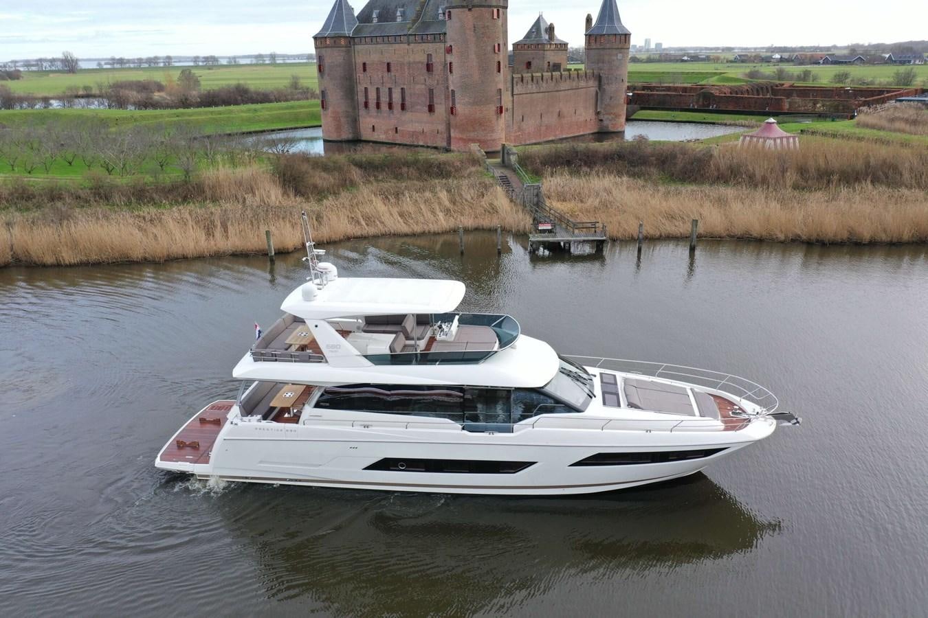 a boat on the water aboard PRESTIGE 680 FLY Yacht for Sale