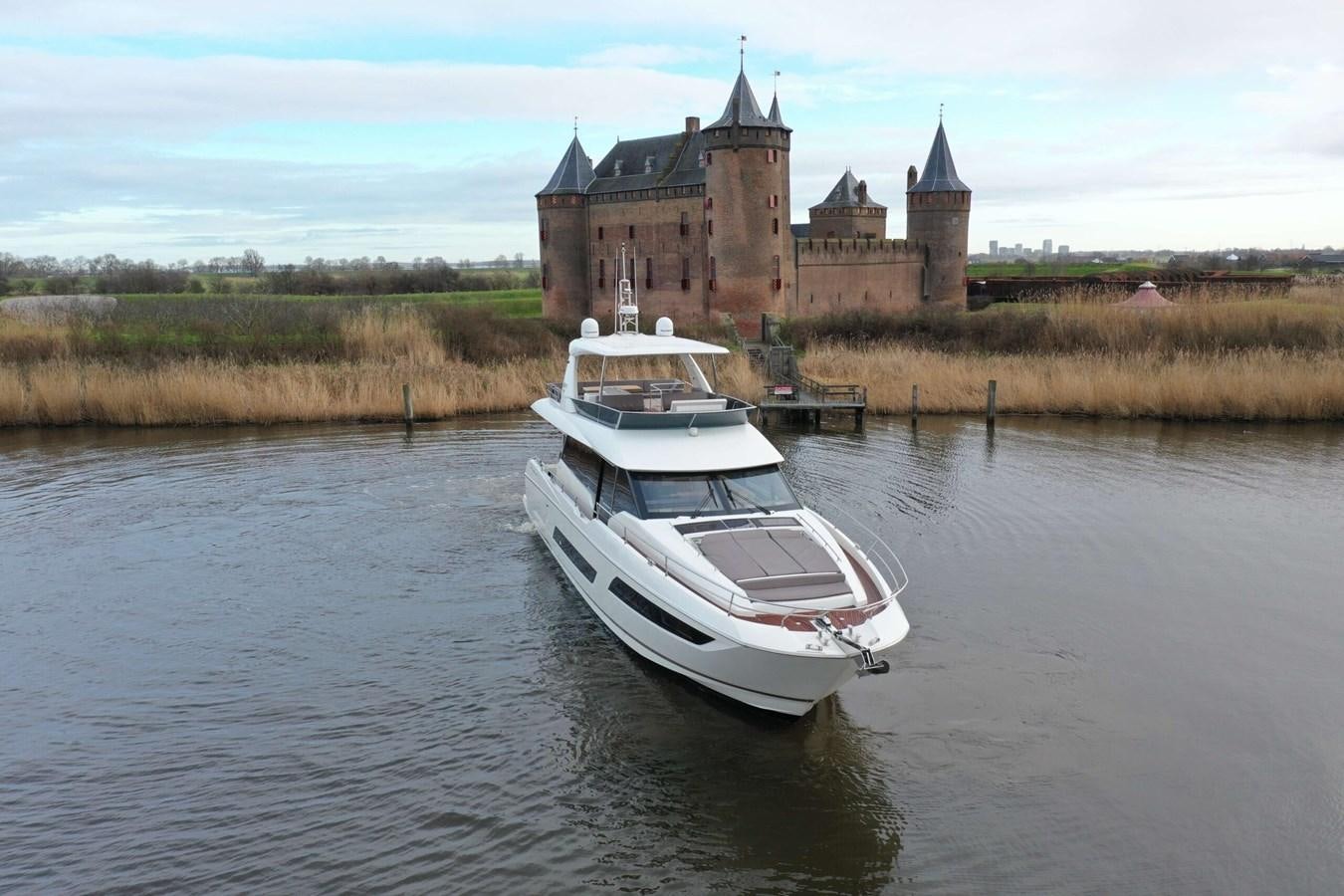 a boat on the water aboard PRESTIGE 680 FLY Yacht for Sale