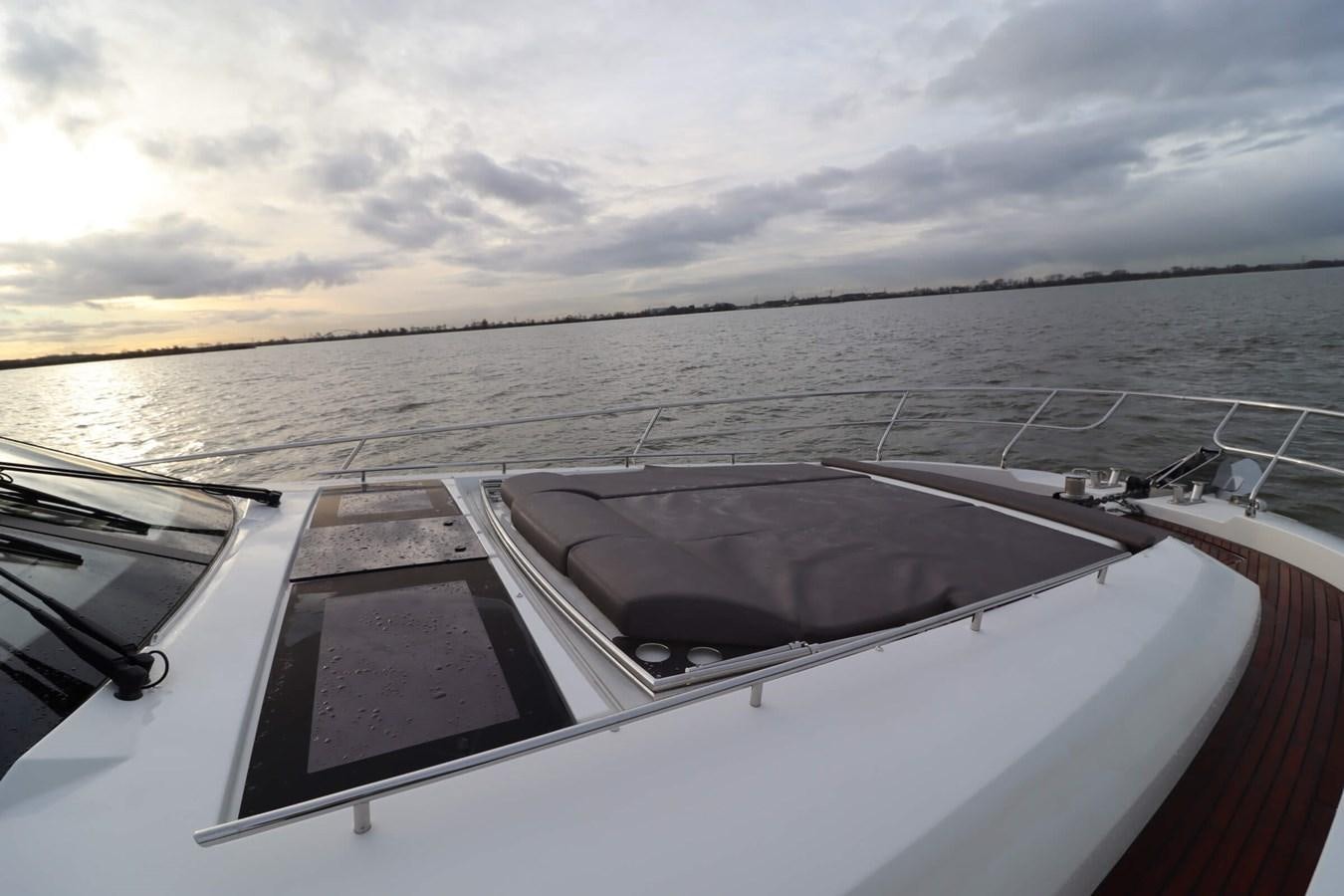 a boat on the water aboard PRESTIGE 680 FLY Yacht for Sale