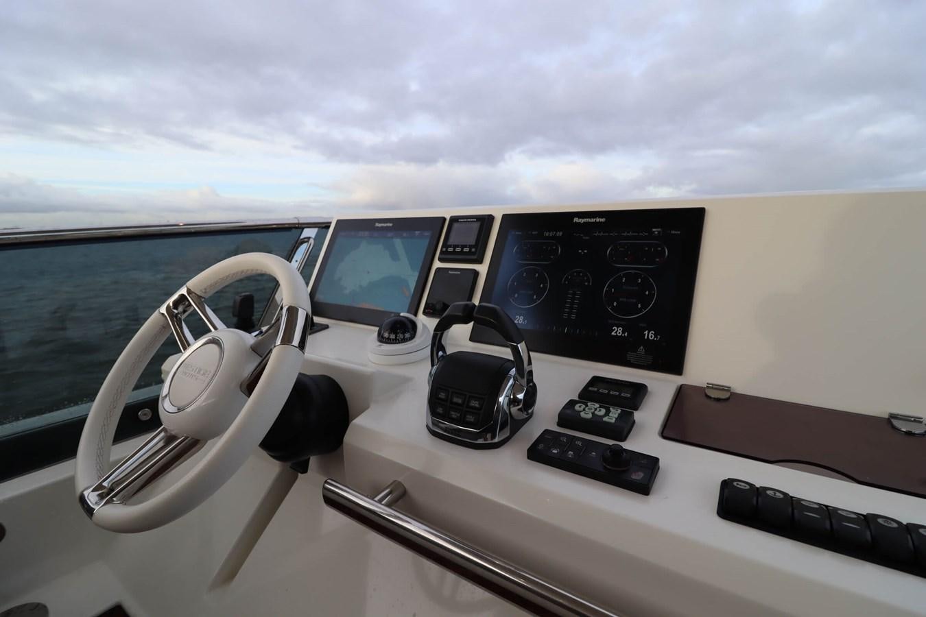 the inside of a car aboard PRESTIGE 680 FLY Yacht for Sale