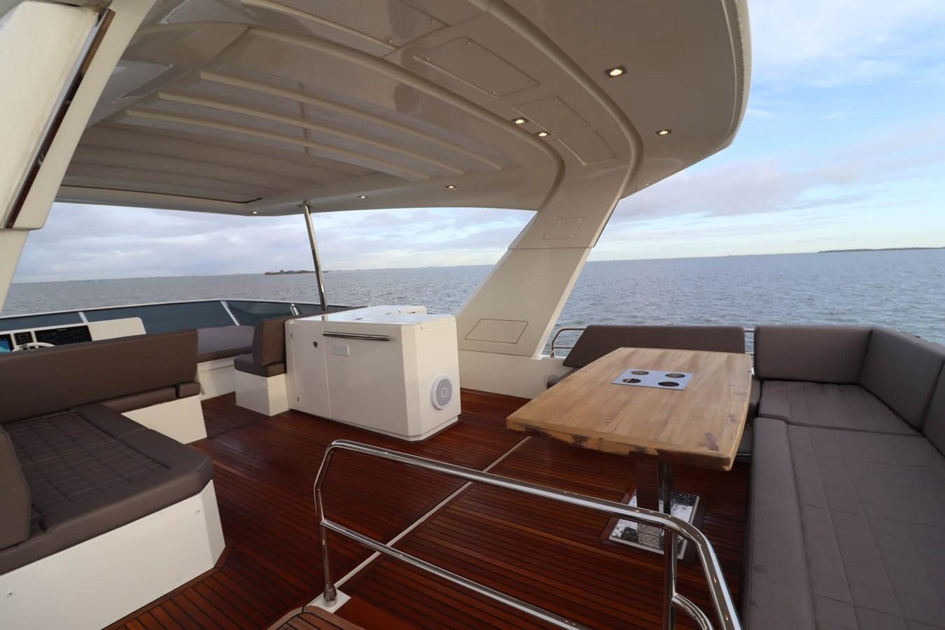 a boat with a table and chairs aboard PRESTIGE 680 FLY Yacht for Sale