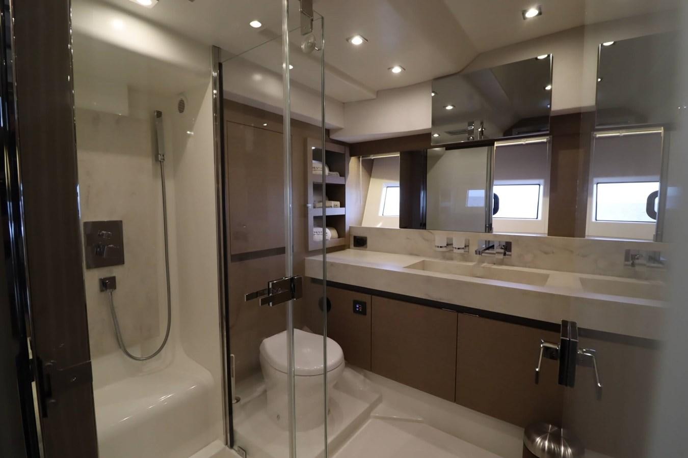 a bathroom with a standup shower aboard PRESTIGE 680 FLY Yacht for Sale
