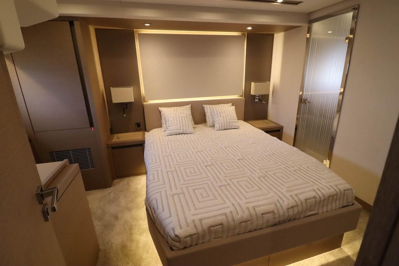 a large bed in a hotel room aboard PRESTIGE 680 FLY Yacht for Sale