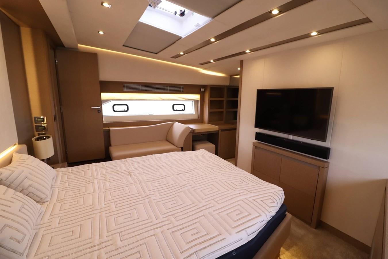 a room with a bed and a tv aboard PRESTIGE 680 FLY Yacht for Sale