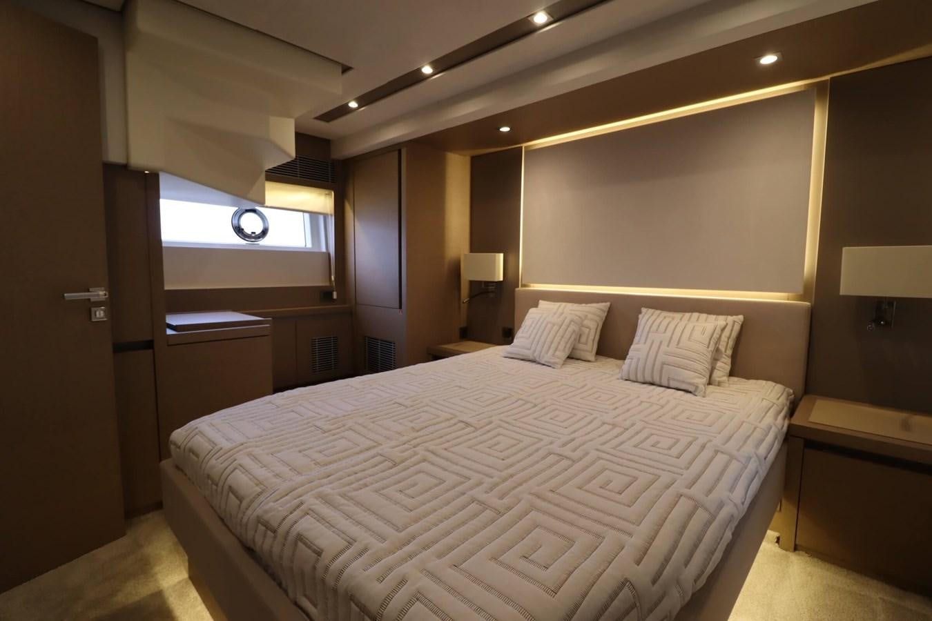 a bed in a hotel room aboard PRESTIGE 680 FLY Yacht for Sale
