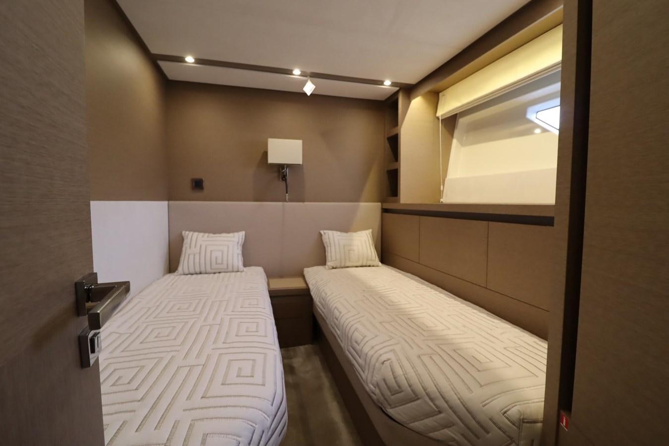 a couple of beds in a hotel room aboard PRESTIGE 680 FLY Yacht for Sale