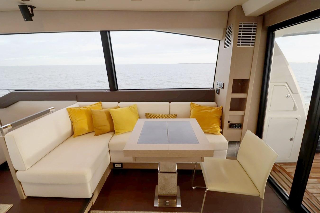 a room with a bed and a window aboard PRESTIGE 680 FLY Yacht for Sale