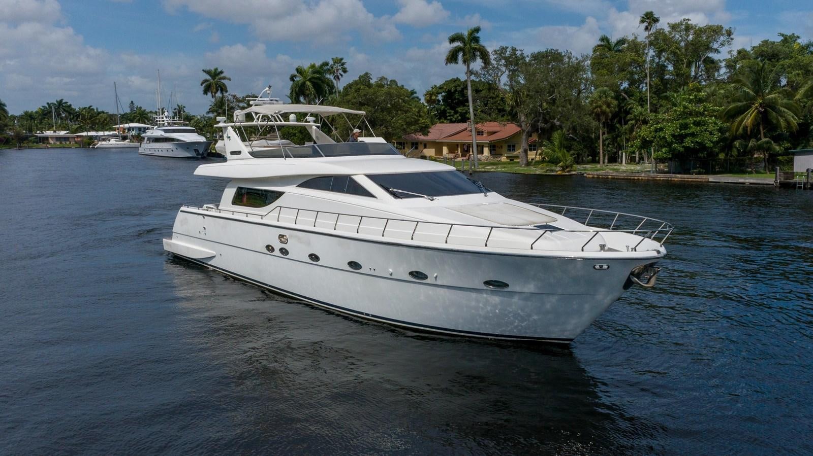 a white yacht in the water aboard FOOLISH PLEASURE Yacht for Sale
