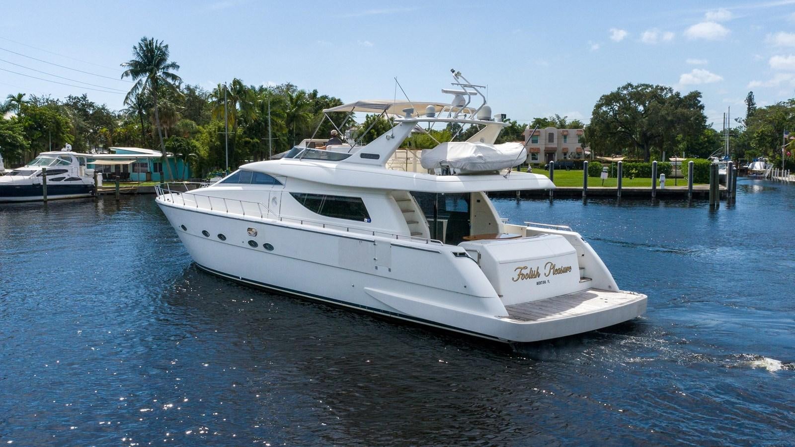 a boat on the water aboard FOOLISH PLEASURE Yacht for Sale