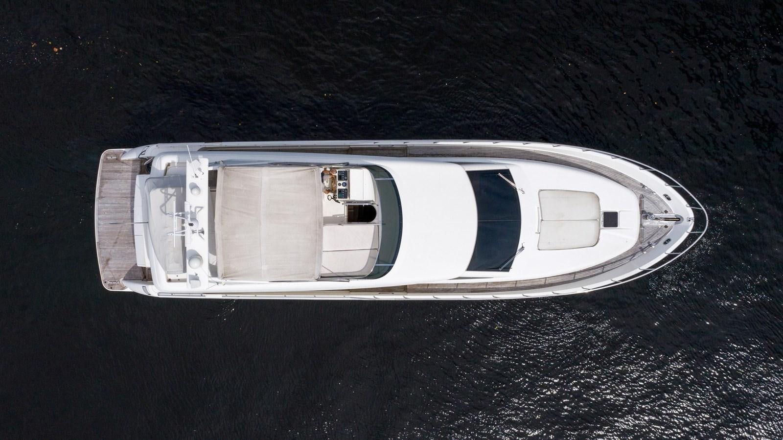 a silver and white vehicle aboard FOOLISH PLEASURE Yacht for Sale