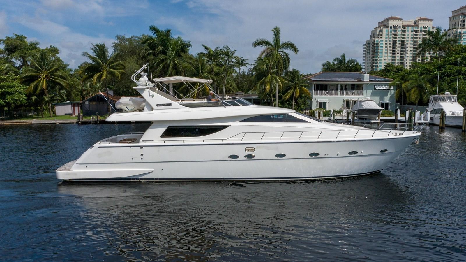 a white yacht in the water aboard FOOLISH PLEASURE Yacht for Sale
