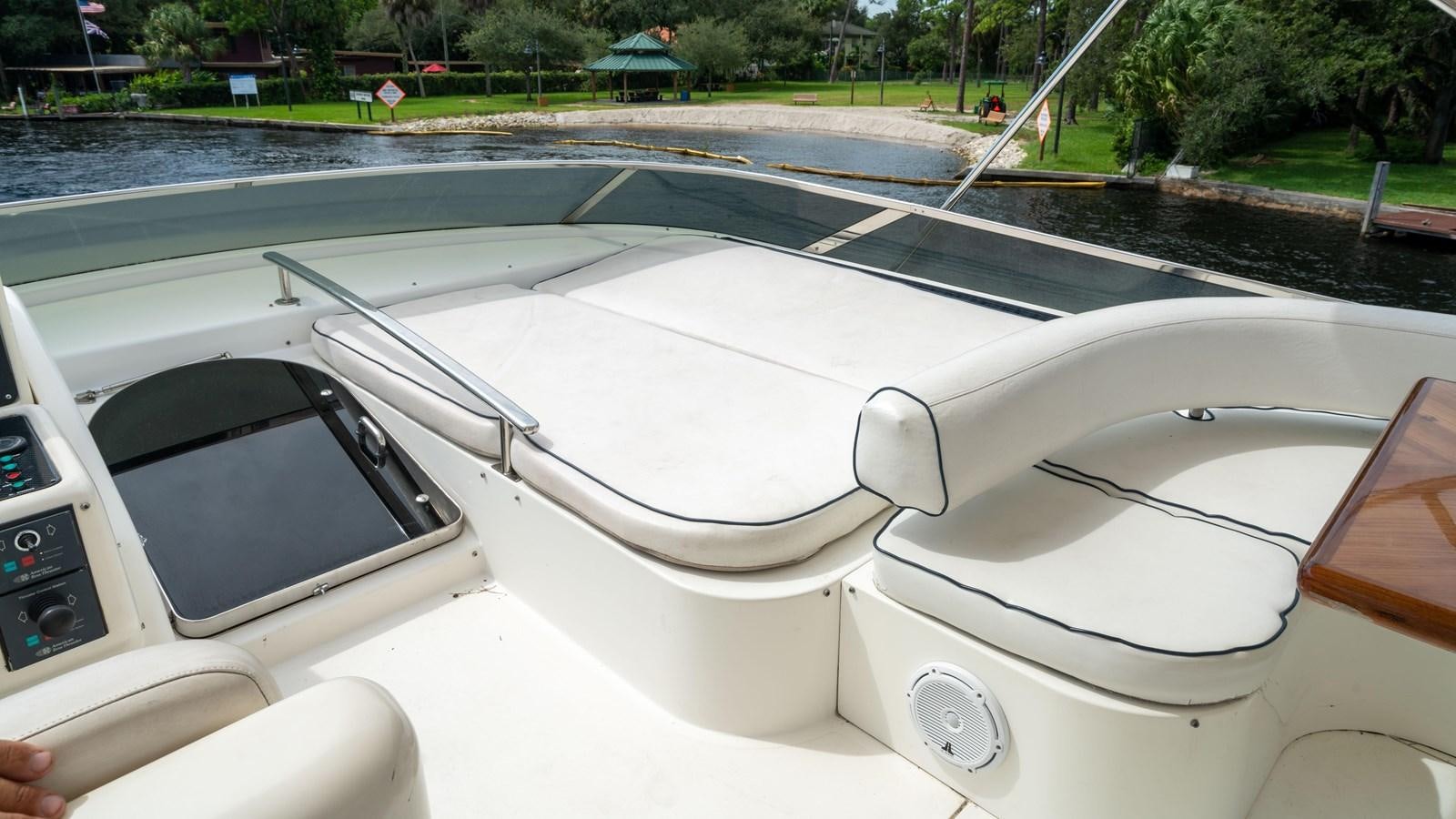 a white car with a seat belt aboard FOOLISH PLEASURE Yacht for Sale