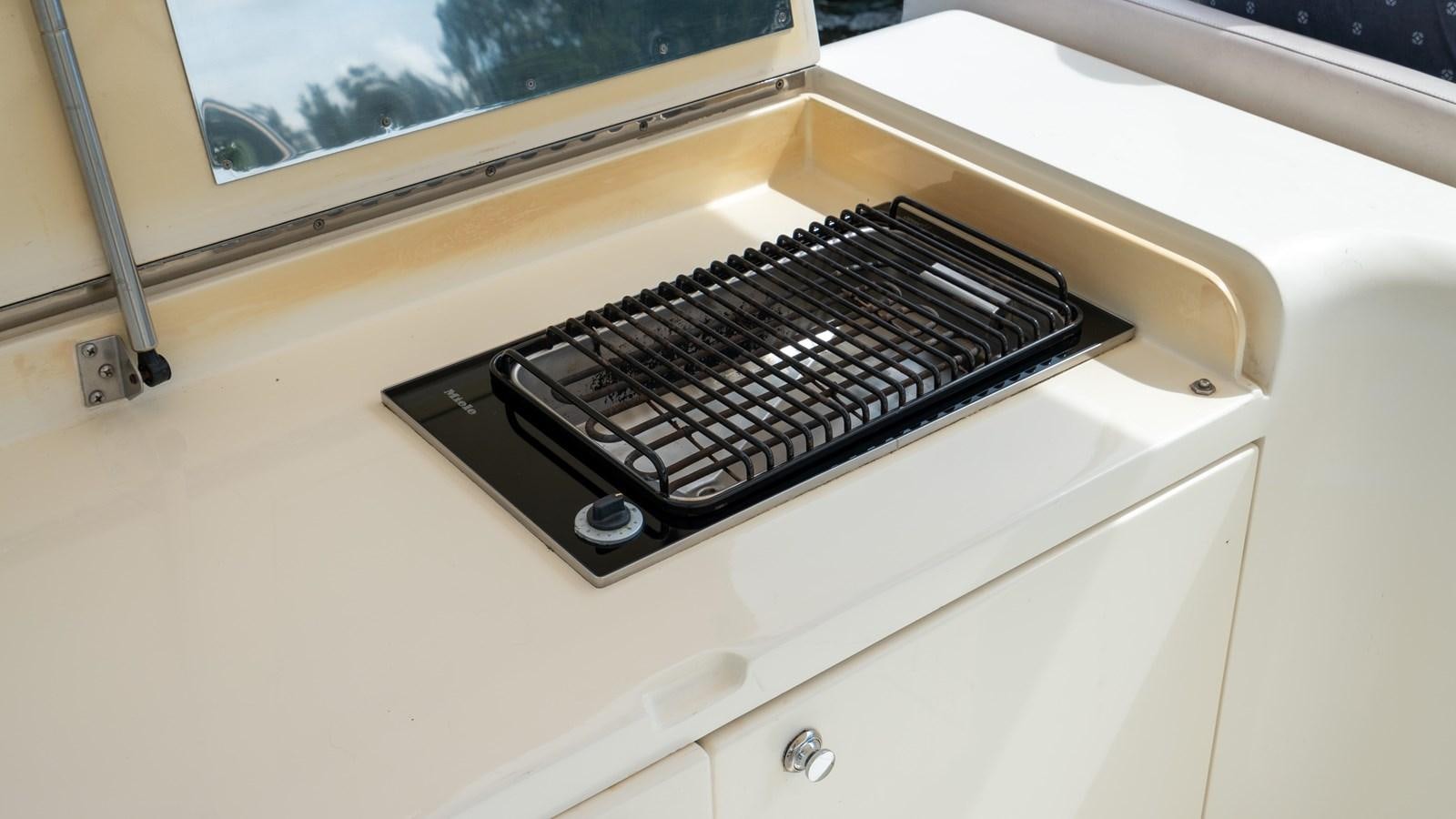 a black and white electronic device aboard FOOLISH PLEASURE Yacht for Sale