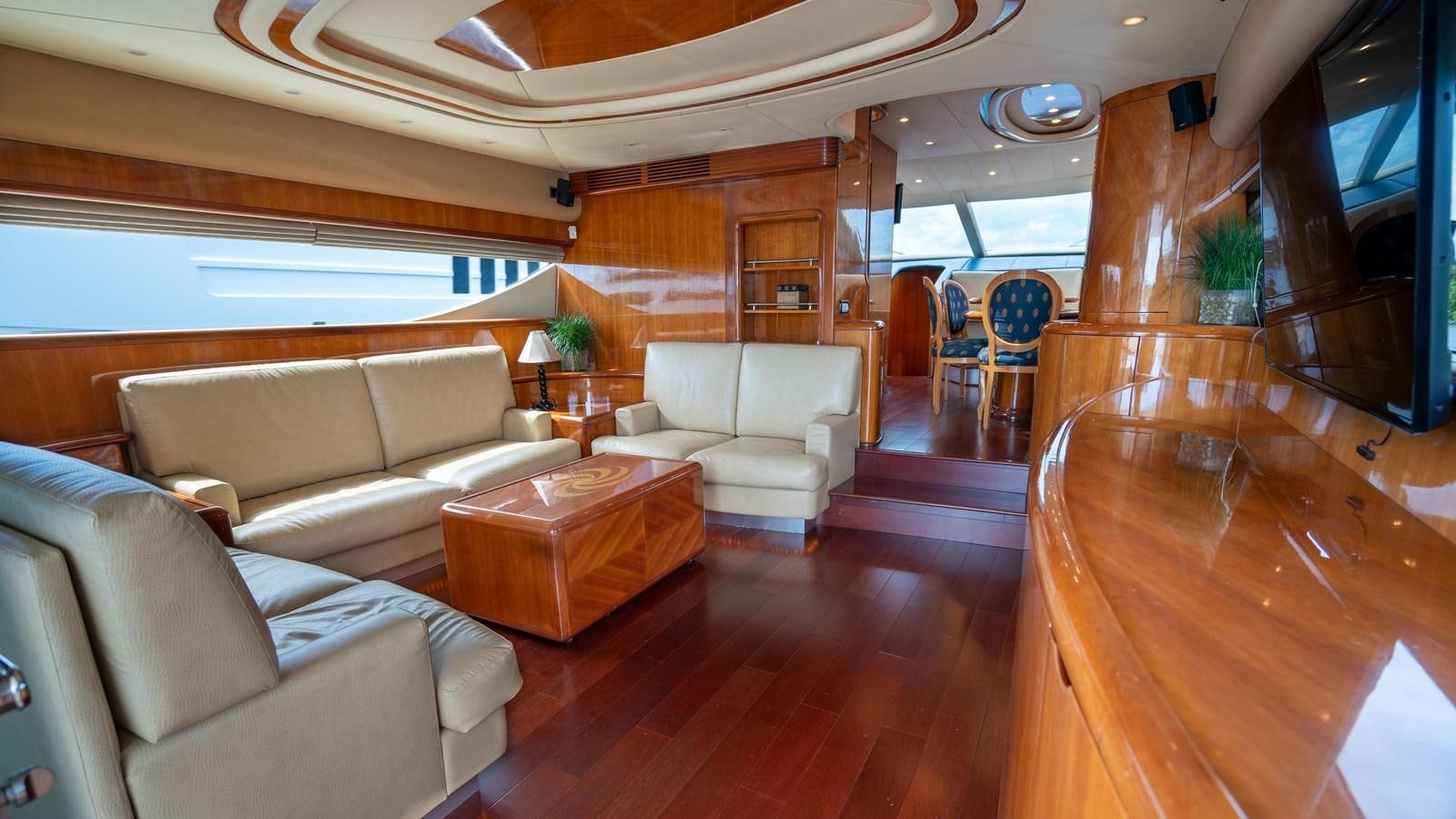 a living room with wood floors aboard FOOLISH PLEASURE Yacht for Sale