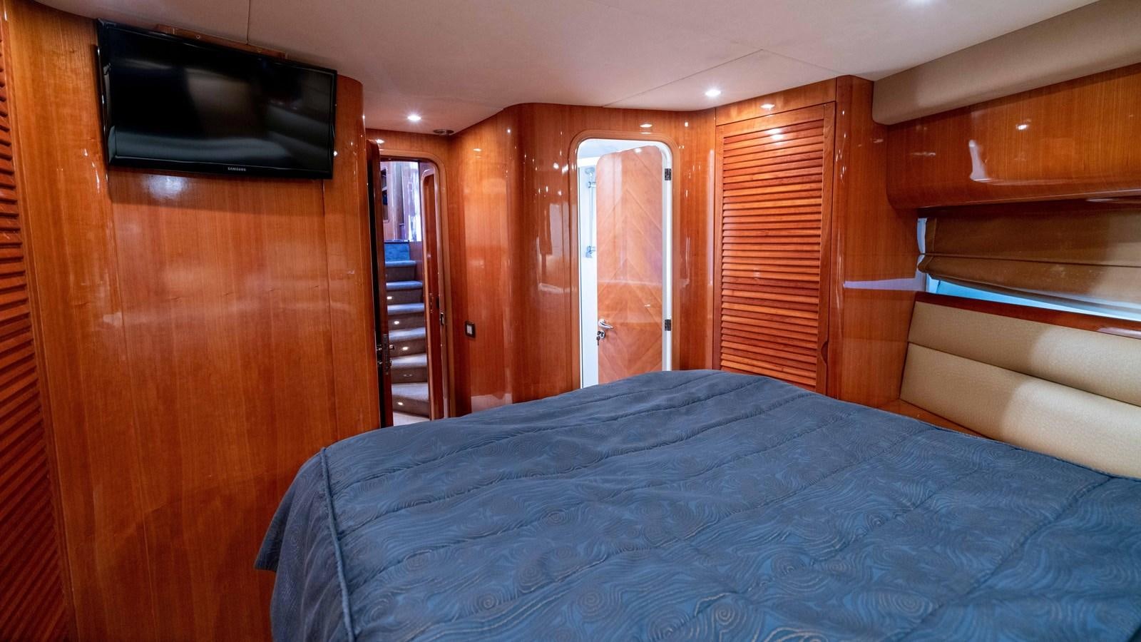 a bed in a cabin aboard FOOLISH PLEASURE Yacht for Sale