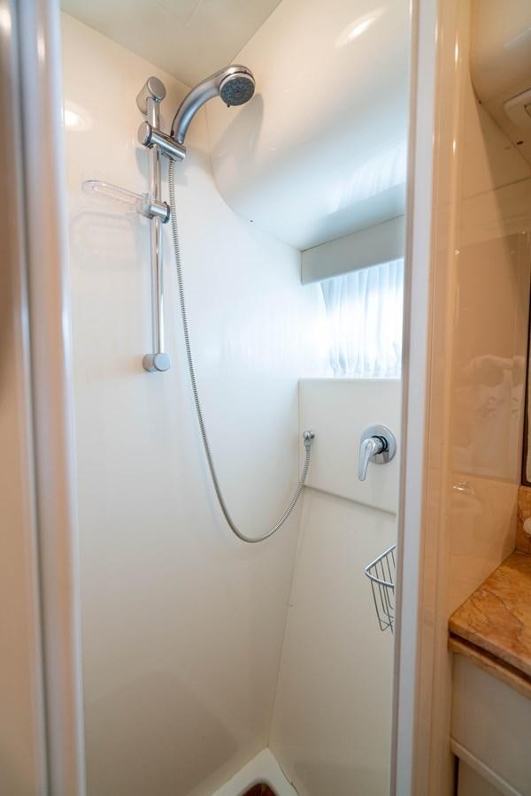 a shower with a glass door aboard FOOLISH PLEASURE Yacht for Sale