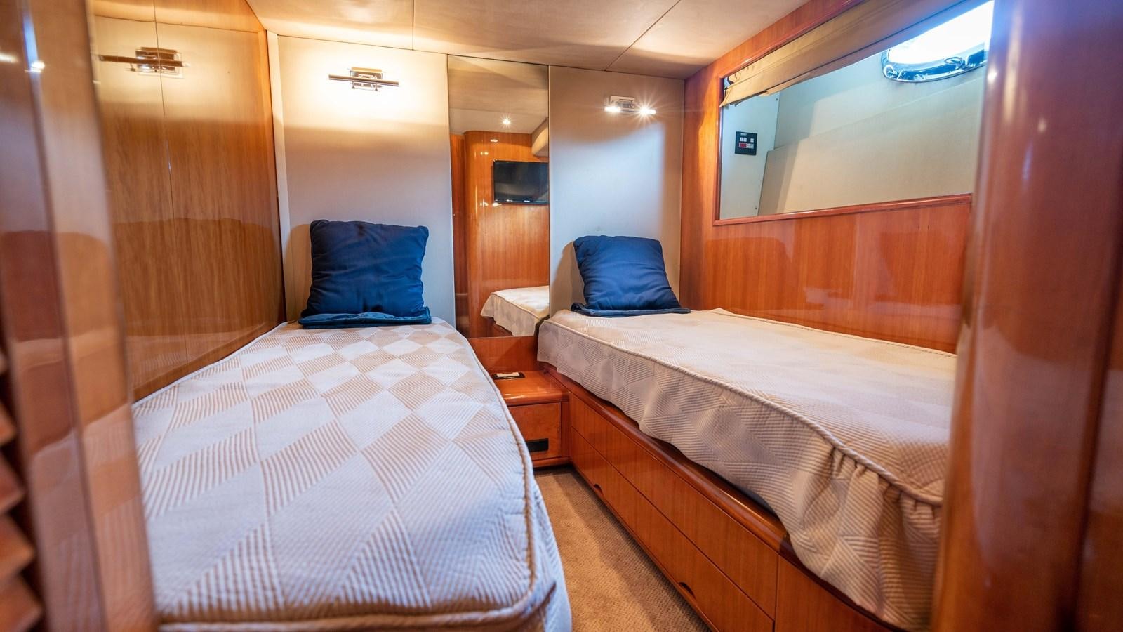 a room with two beds aboard FOOLISH PLEASURE Yacht for Sale