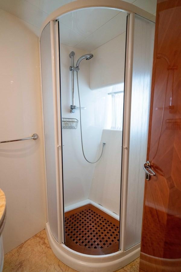 a shower with a red rug aboard FOOLISH PLEASURE Yacht for Sale
