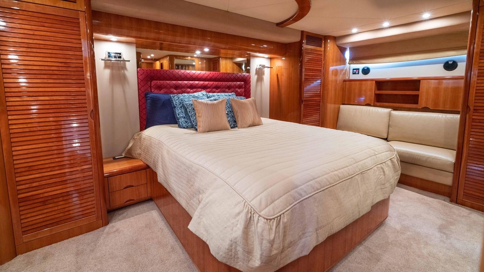 a bed in a room aboard FOOLISH PLEASURE Yacht for Sale
