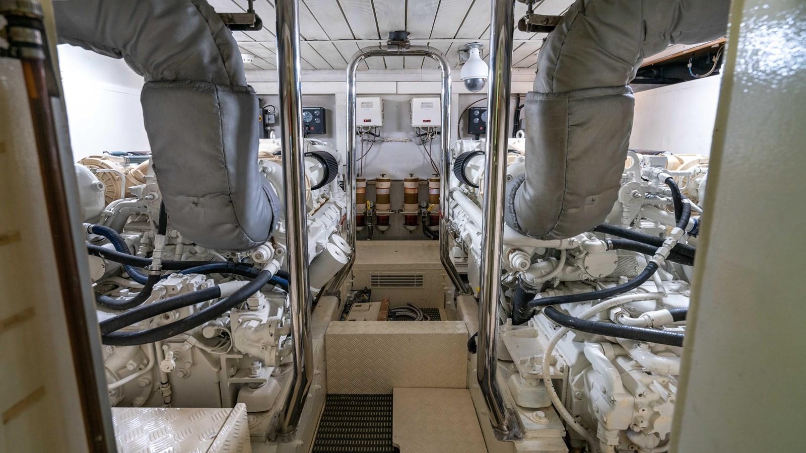 a person working on a machine aboard FOOLISH PLEASURE Yacht for Sale