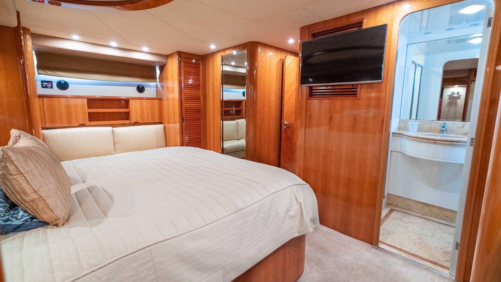 a bed in a room aboard FOOLISH PLEASURE Yacht for Sale