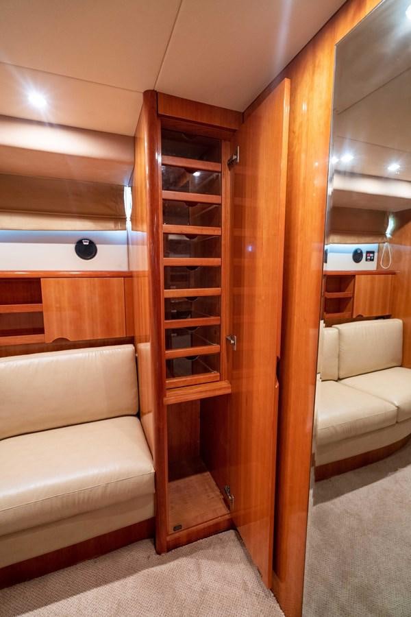 a wood cabinet in a room aboard FOOLISH PLEASURE Yacht for Sale
