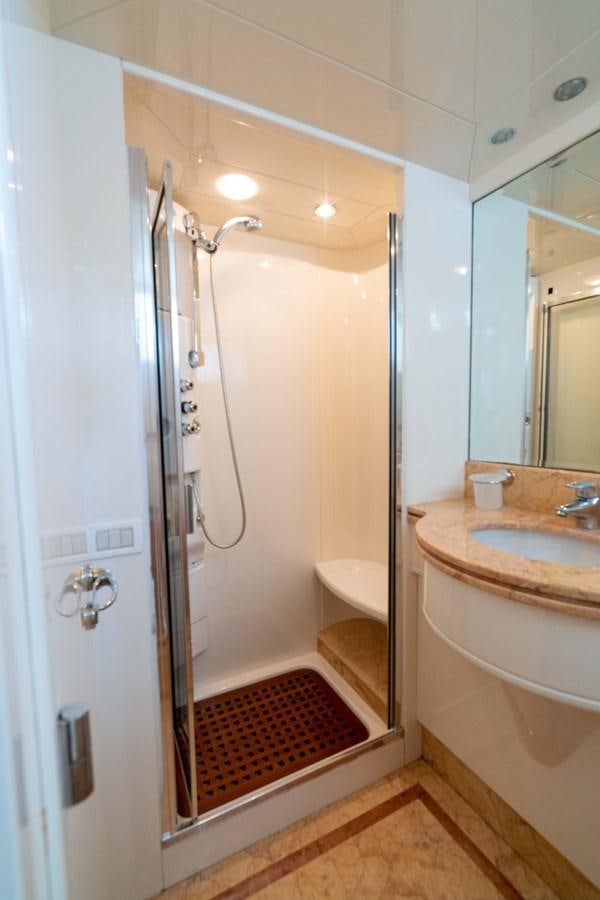 a bathroom with a sink and a bathtub aboard FOOLISH PLEASURE Yacht for Sale