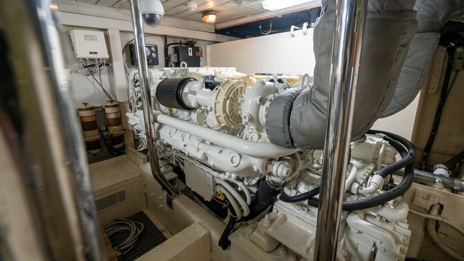 a machine with a large metal pipe aboard FOOLISH PLEASURE Yacht for Sale