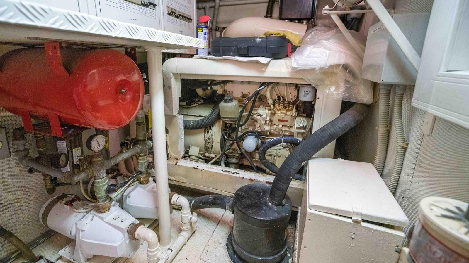 a machine with a pipe aboard FOOLISH PLEASURE Yacht for Sale