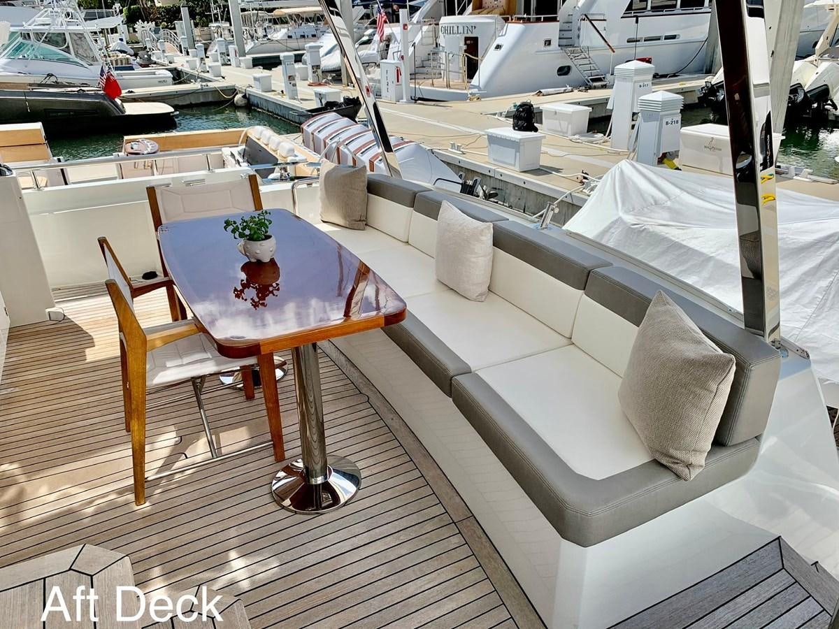 a table and chairs on a boat aboard PLAYBOOK Yacht for Sale