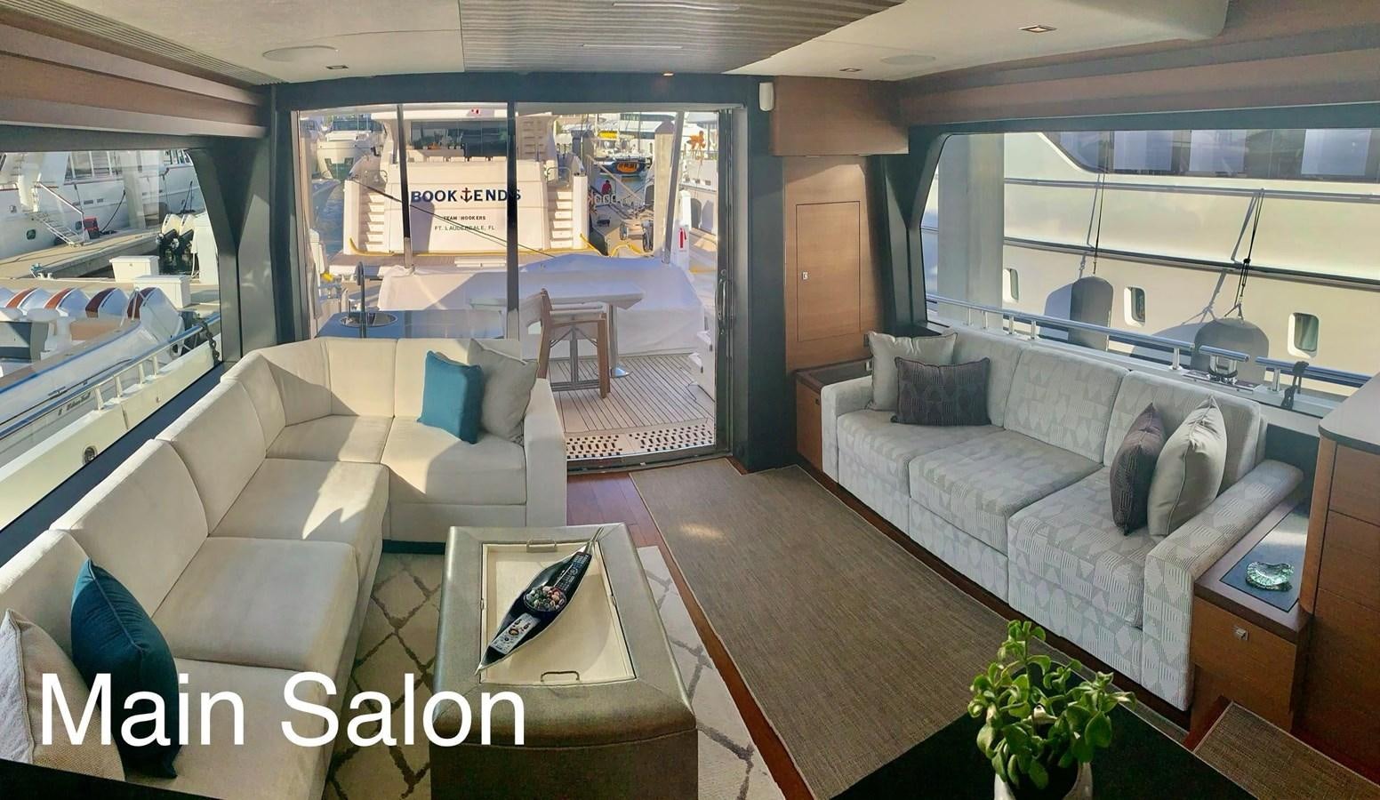 a living room with a large window aboard PLAYBOOK Yacht for Sale