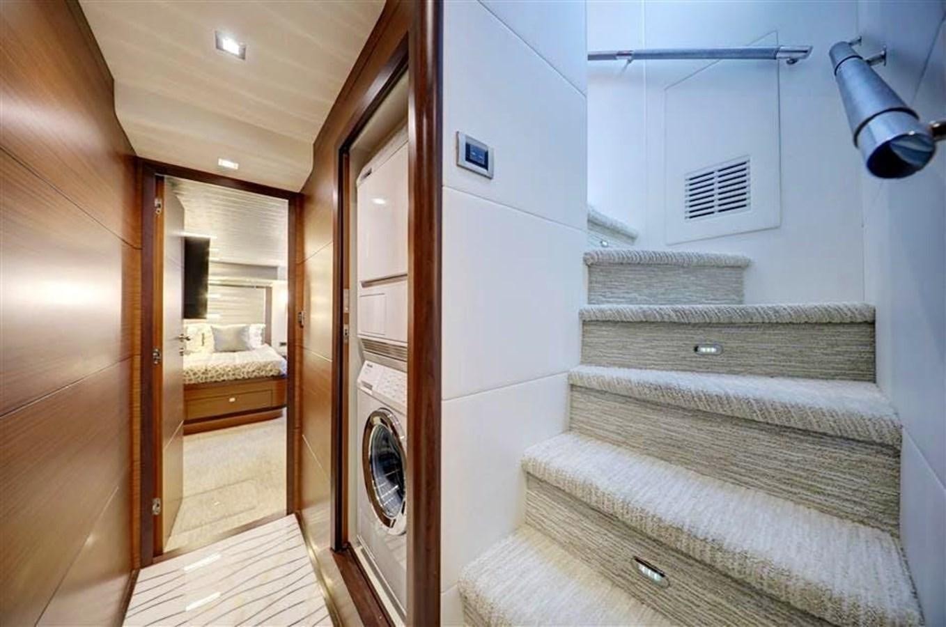 a room with a staircase and a bed aboard PLAYBOOK Yacht for Sale