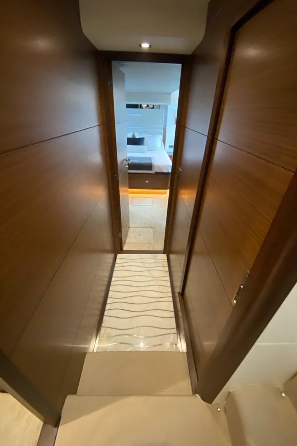 a hallway with a glass door aboard PLAYBOOK Yacht for Sale