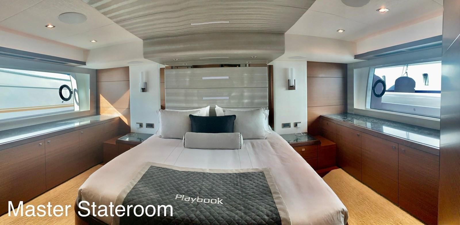 a large bed in a room aboard PLAYBOOK Yacht for Sale