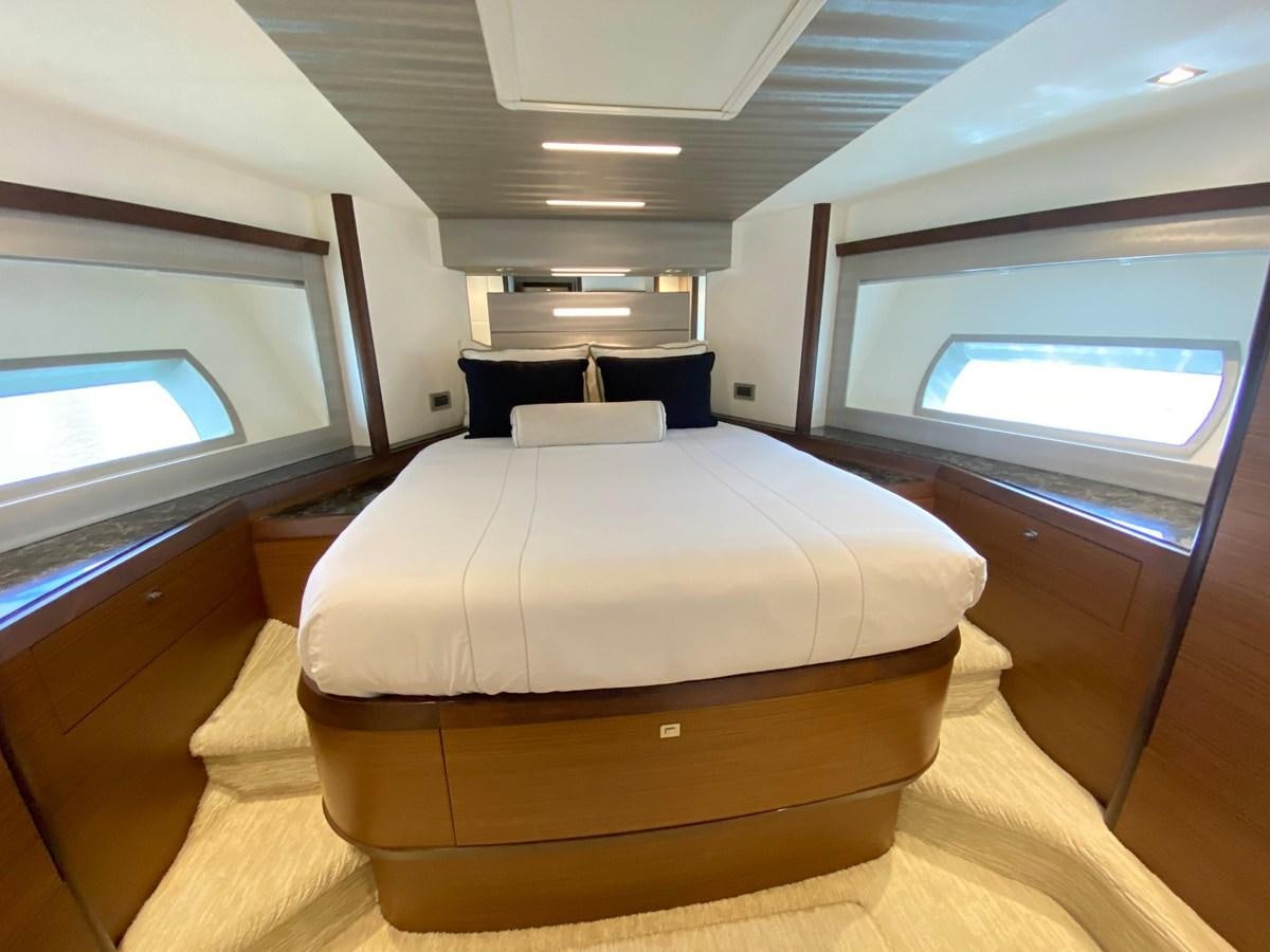 a room with a bed and a tv aboard PLAYBOOK Yacht for Sale