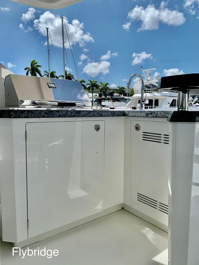 a white washing machine aboard PLAYBOOK Yacht for Sale