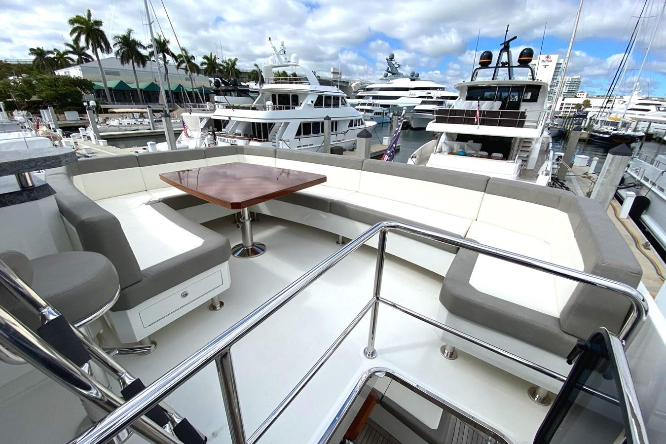 a boat docked at a pier aboard PLAYBOOK Yacht for Sale