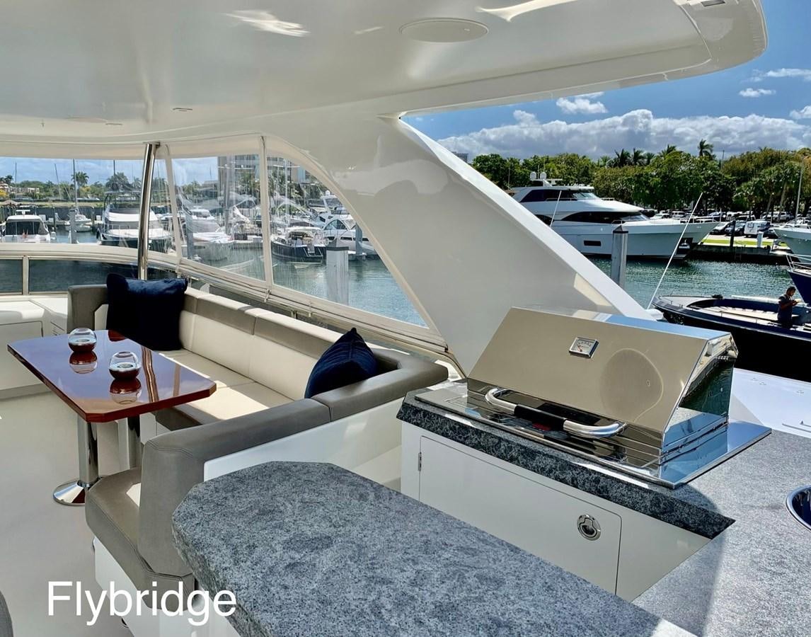 a room with a large window and a view of the water aboard PLAYBOOK Yacht for Sale