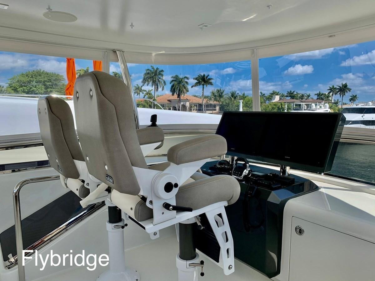a white vehicle with a black screen aboard PLAYBOOK Yacht for Sale