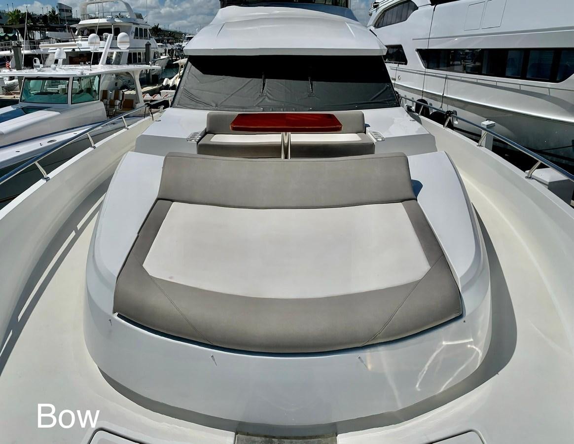 a white yacht with a red stripe aboard PLAYBOOK Yacht for Sale