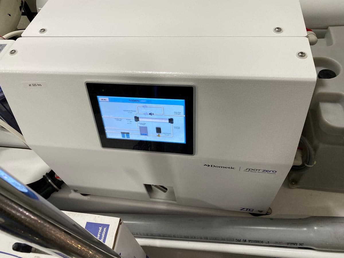 a white electronic device aboard PLAYBOOK Yacht for Sale