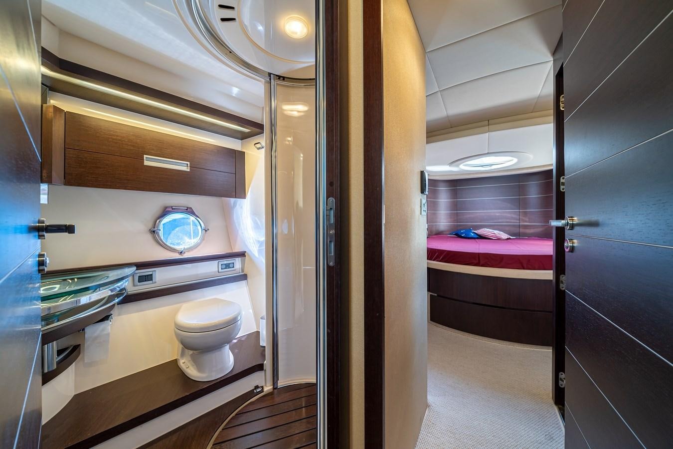 a bathroom with a toilet and a sink aboard AROMA Yacht for Sale