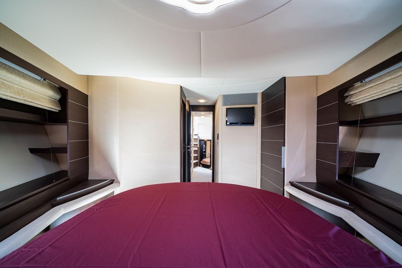 a purple bed in a room aboard AROMA Yacht for Sale