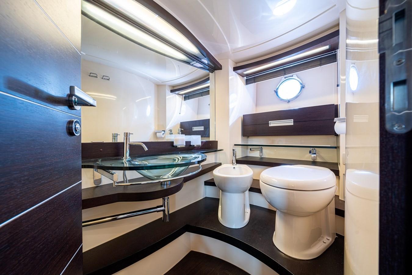 a bathroom with a large mirror aboard AROMA Yacht for Sale
