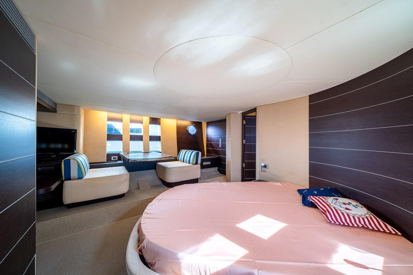 a room with a bed and a tv aboard AROMA Yacht for Sale