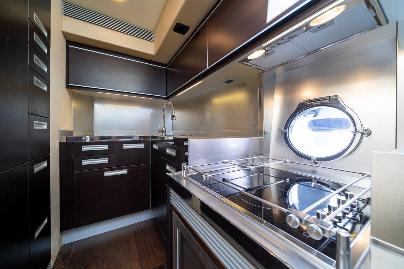 a kitchen with a large sink aboard AROMA Yacht for Sale