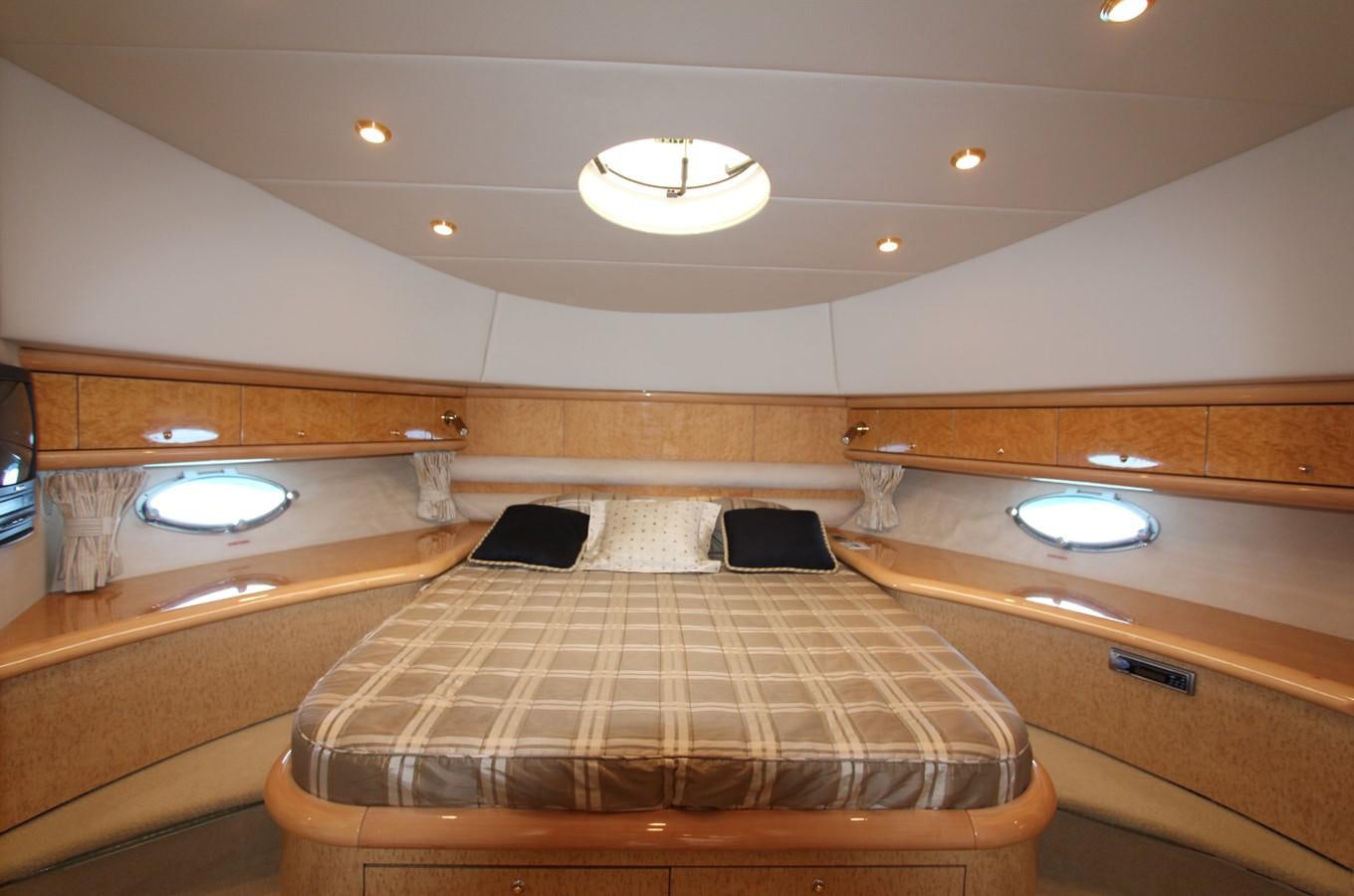 a room with a bed and a sink aboard NIKA Yacht for Sale